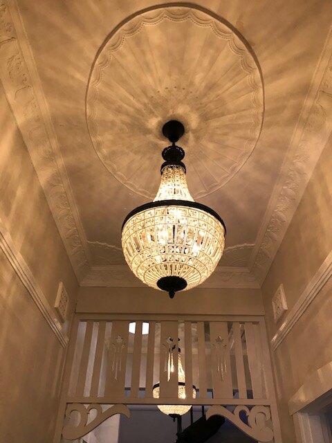 Ornate chandelier installation in a heritage Perth home