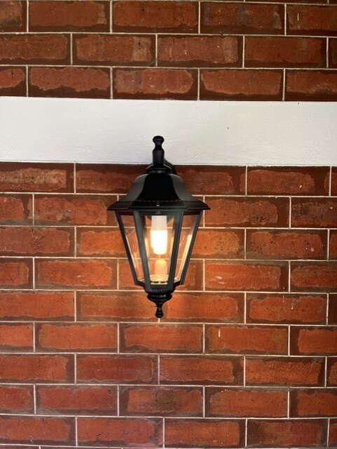 Exterior lantern installed on a brick wall