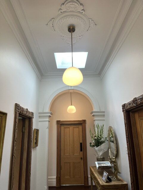 Pendant lighting installed in a heritage hallway